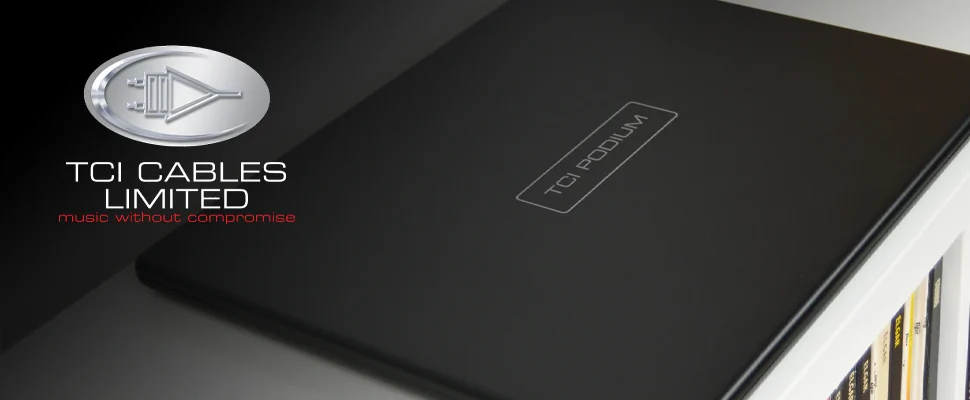 Alt text: "TCI Cables Limited logo and slogan next to a sleek black TCI Podium device on a shelf. The scene conveys a modern and sophisticated tone."