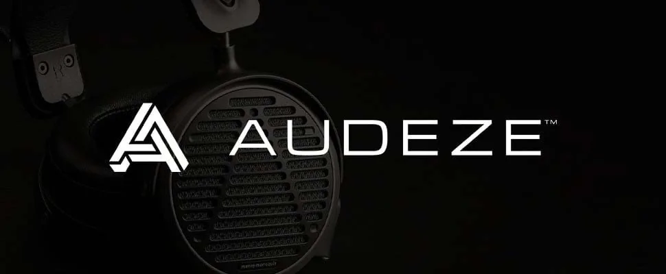 Close-up of a sleek, black Audeze headphone with a mesh grill. The logo "AUDEZE" is prominently displayed on the right against a black background.