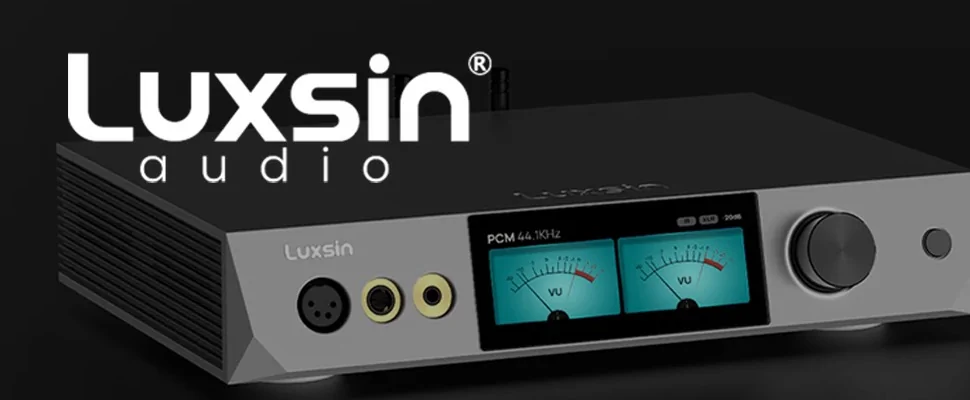 Luxsin audio interface on a black background, featuring VU meters, various input jacks, and a large volume knob. Sleek and modern design.