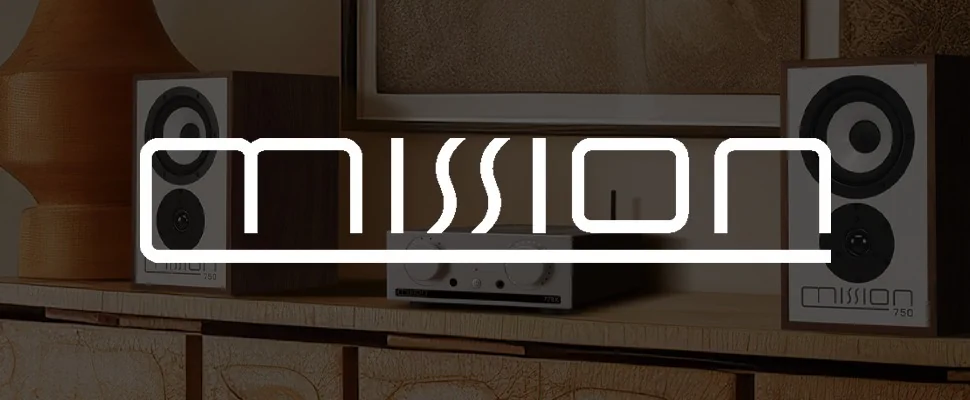 Stylish interior with a modern audio setup; two speakers labelled "mission" frame a sleek console on a wooden shelf, evoking a cosy, tech-savvy ambiance.