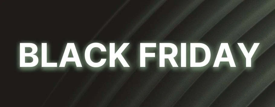 The image displays the words "BLACK FRIDAY" in bold, white letters against a dark, textured background.