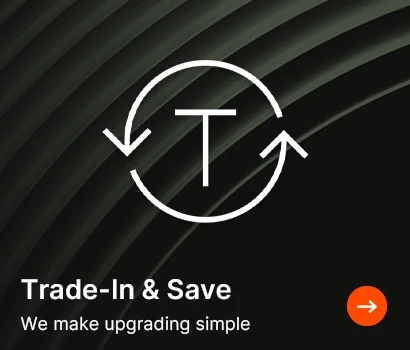 Dark abstract background with curved lines, a circular arrow symbol surrounding the letter 'T'. Text reads 'Trade-In & Save: We make upgrading simple.' An orange arrow icon is on the right.
