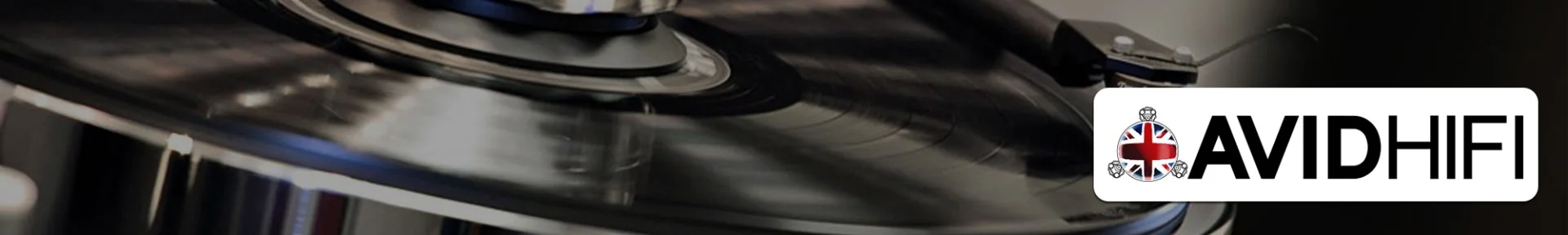 Close-up of a spinning record on a turntable with a stylus, set against a dark background. The AVIDHIFI logo appears on the right, featuring a British flag emblem.