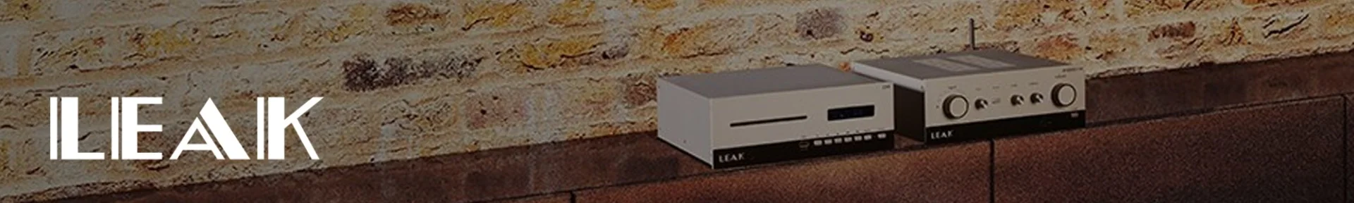 Retro-style audio equipment sits on a wooden shelf against a rustic brick wall. The scene conveys a vintage and sophisticated ambiance.