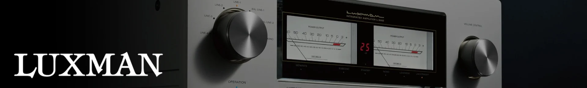 Close-up of a Luxman amplifier with two large dials and illuminated power output meters. The sleek design and dim lighting convey modern sophistication.