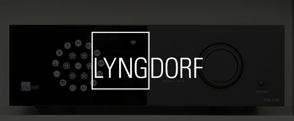 Close-up of a sleek audio device featuring a circular button layout on a black panel. The word "Lyngdorf" appears on the left. Modern and minimalistic design.