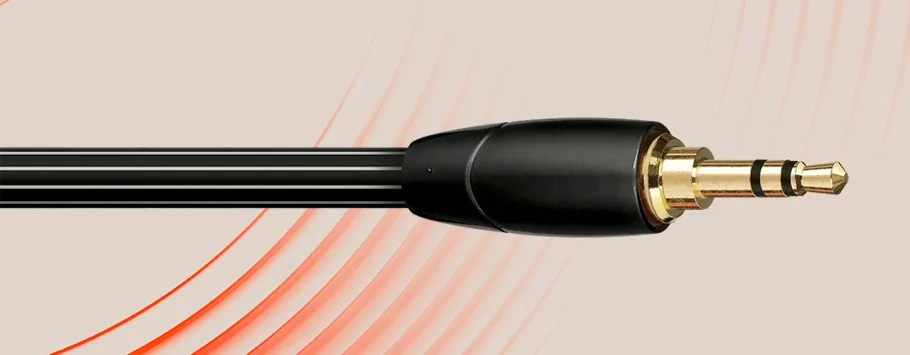 A close-up of a black audio cable with a gold-plated 3.5mm jack against a beige background with red curved lines.