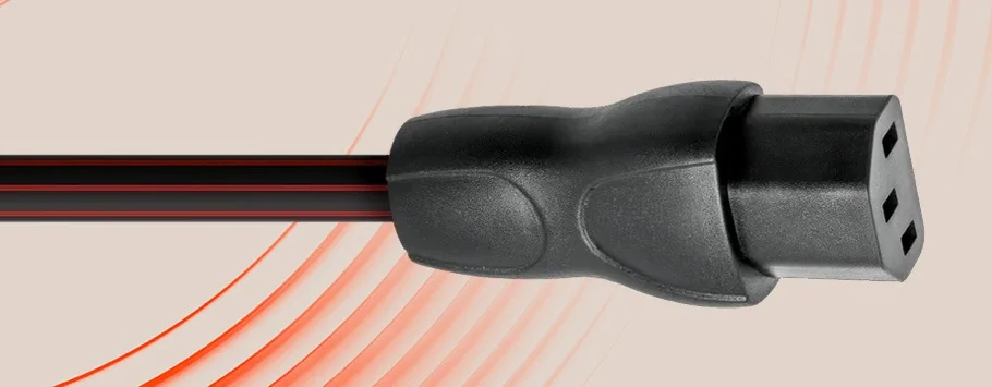 Close-up of a black power cord plug with three prongs on a beige background with curved red lines.