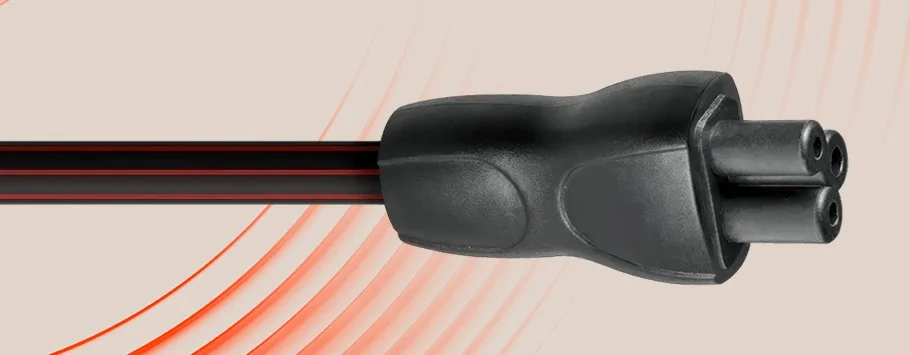 Close-up of a black electric plug with three round prongs, set against a beige background with red curved lines, conveying a sleek, modern feel.