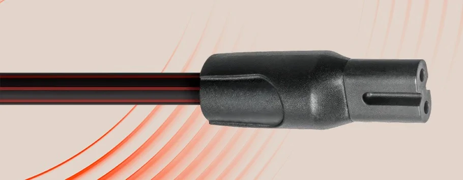 Close-up of a black, two-pronged electrical plug against a beige background with curved red lines.