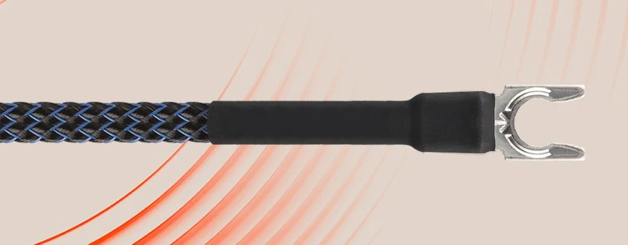 Black braided audio cable with a metal spade connector against a beige background with curved red lines, conveying a modern, technical tone.