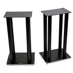 Two black speaker stands with rectangular bases and tops, each supported by four vertical columns. The design is sleek, modern, and minimalist.