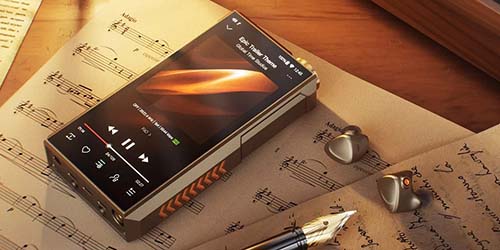 A music player displays a song over sheet music, accompanied by earbuds and a fountain pen. The wooden table and warm lighting create a cozy atmosphere.