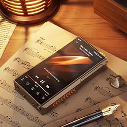 A vintage-style digital music player on sheet music, under warm light. Nearby are a pen and a heart-shaped accessory, creating a nostalgic ambiance.