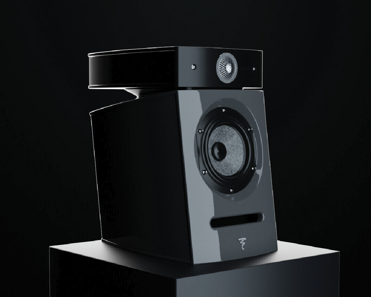 Sleek black speaker with a modern design, featuring a circular top component and larger bottom section on a dark background, conveying elegance.