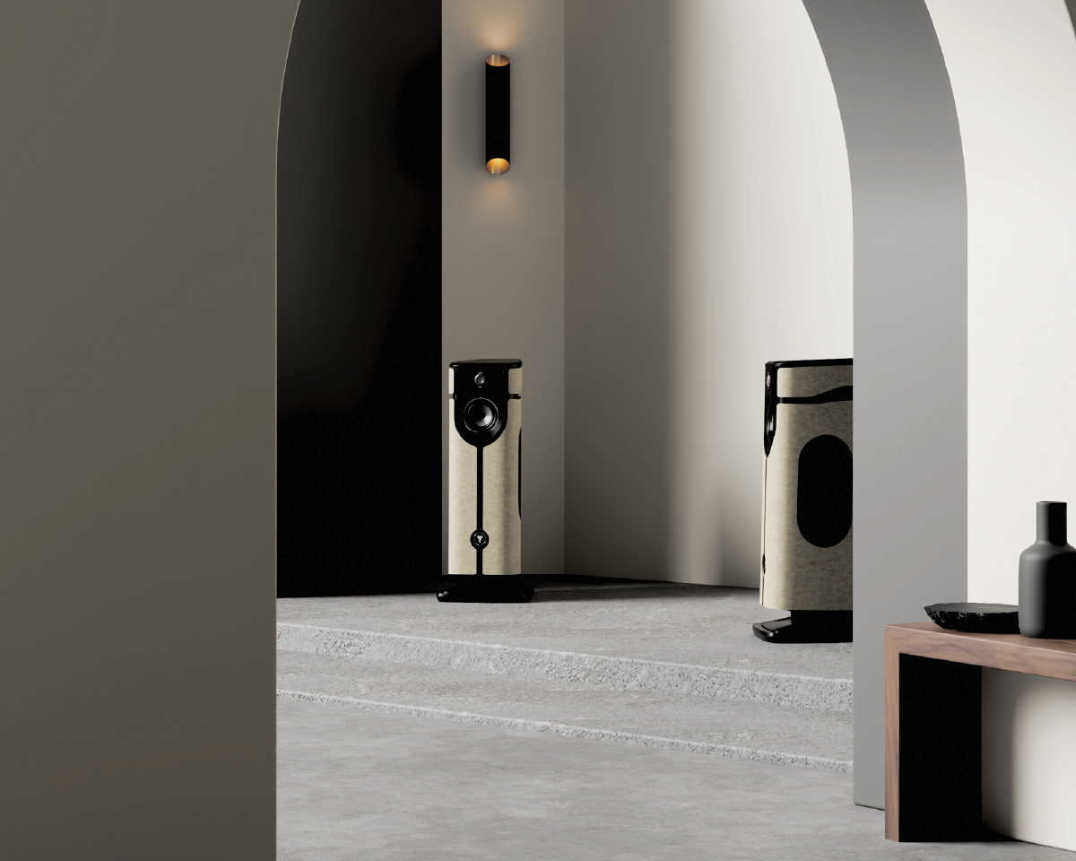 Modern interior with minimalist design featuring two sleek, beige floor speakers framed by archways. A wall sconce casts warm lighting, creating a sophisticated ambiance.