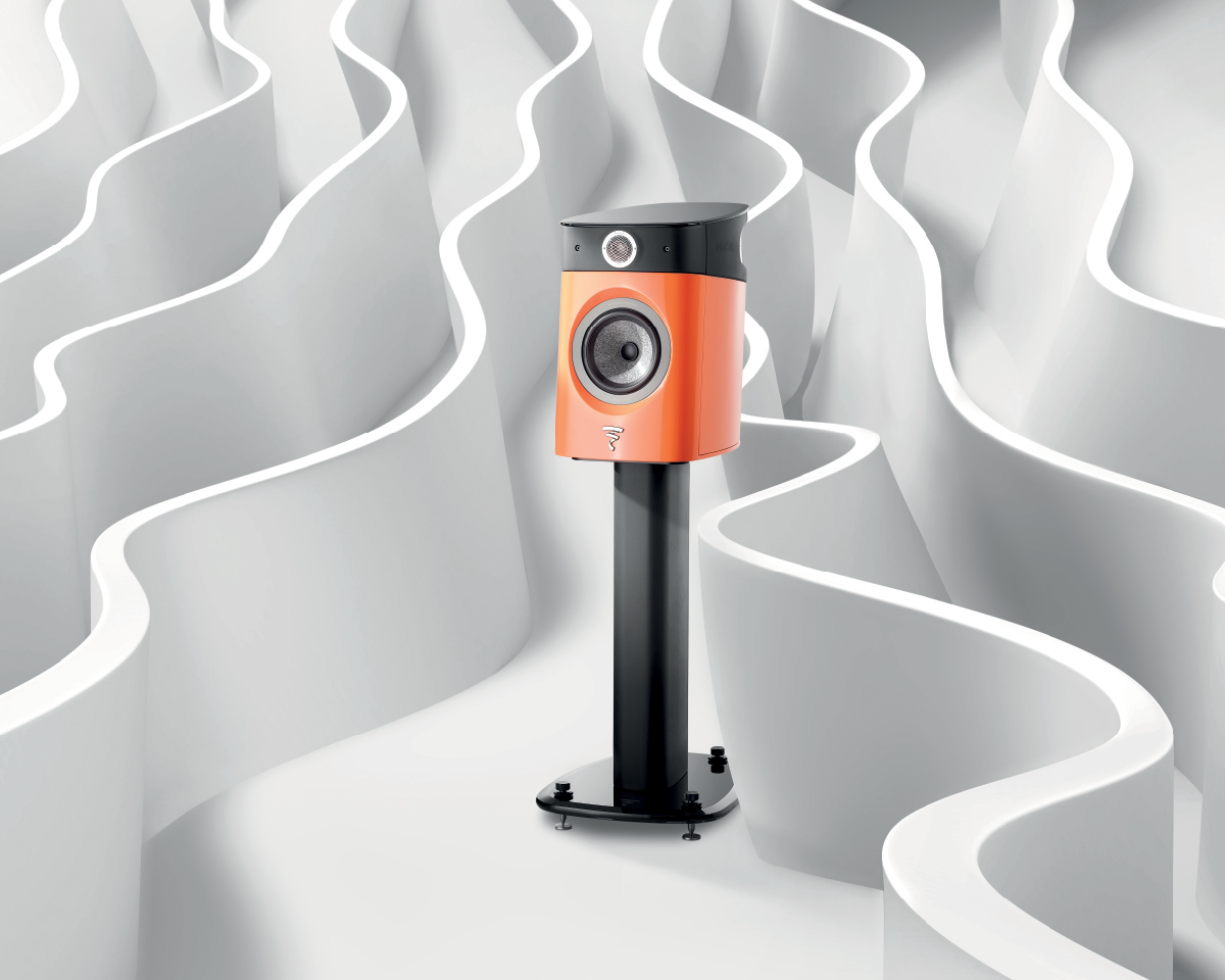 A sleek, orange and black speaker on a stand is set against a backdrop of white, flowing, wave-like patterns, creating a modern and stylish atmosphere.