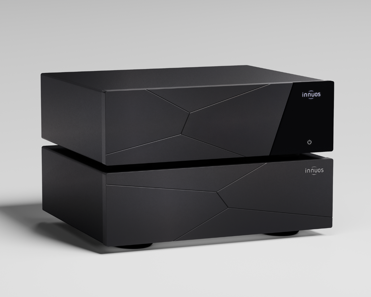 A sleek, modern, black audio equipment stack with angular front panel designs. The minimalist style conveys a sense of sophistication and technology.