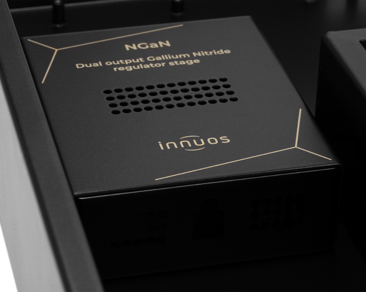 Black electronic device labeled "NGaN Dual output Gallium Nitride regulator stage" and "innuos" logo, featuring a grid of ventilation holes.