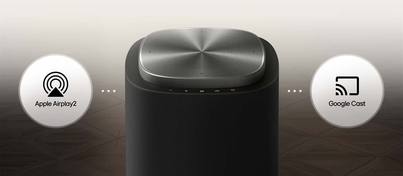 A sleek black speaker with a textured top is centered, flanked by Apple Airplay 2 and Google Cast icons, suggesting wireless streaming capabilities.
