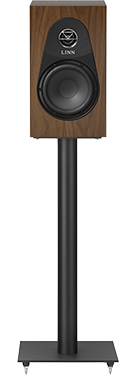 Wooden speaker with a large round black woofer, set on a tall black stand against a black background, conveying a sleek and modern design.