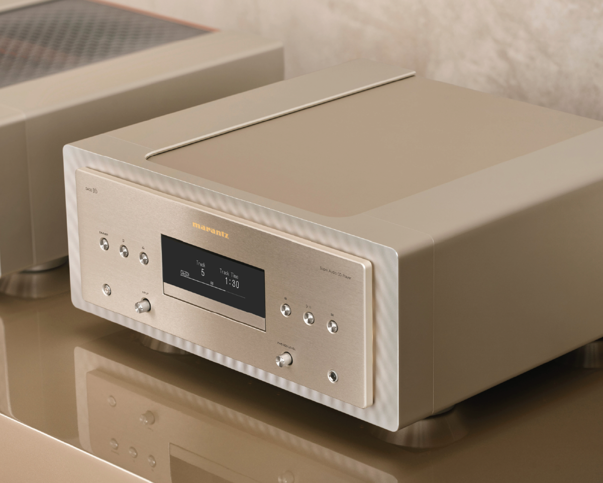 High-end beige audio system with a digital display showing track details, sleek metallic buttons, set on a reflective surface, conveying luxury.