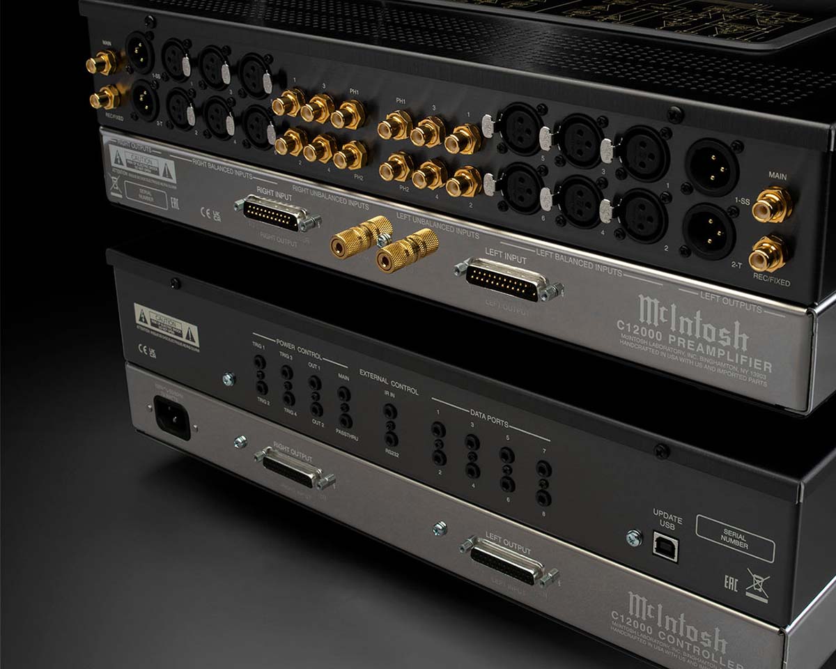 The image shows the rear panels of two high-end audio components. They feature numerous gold-plated connectors, including XLR and RCA inputs, labeled for balanced and unbalanced connections. The sleek metallic design highlights precision and quality.