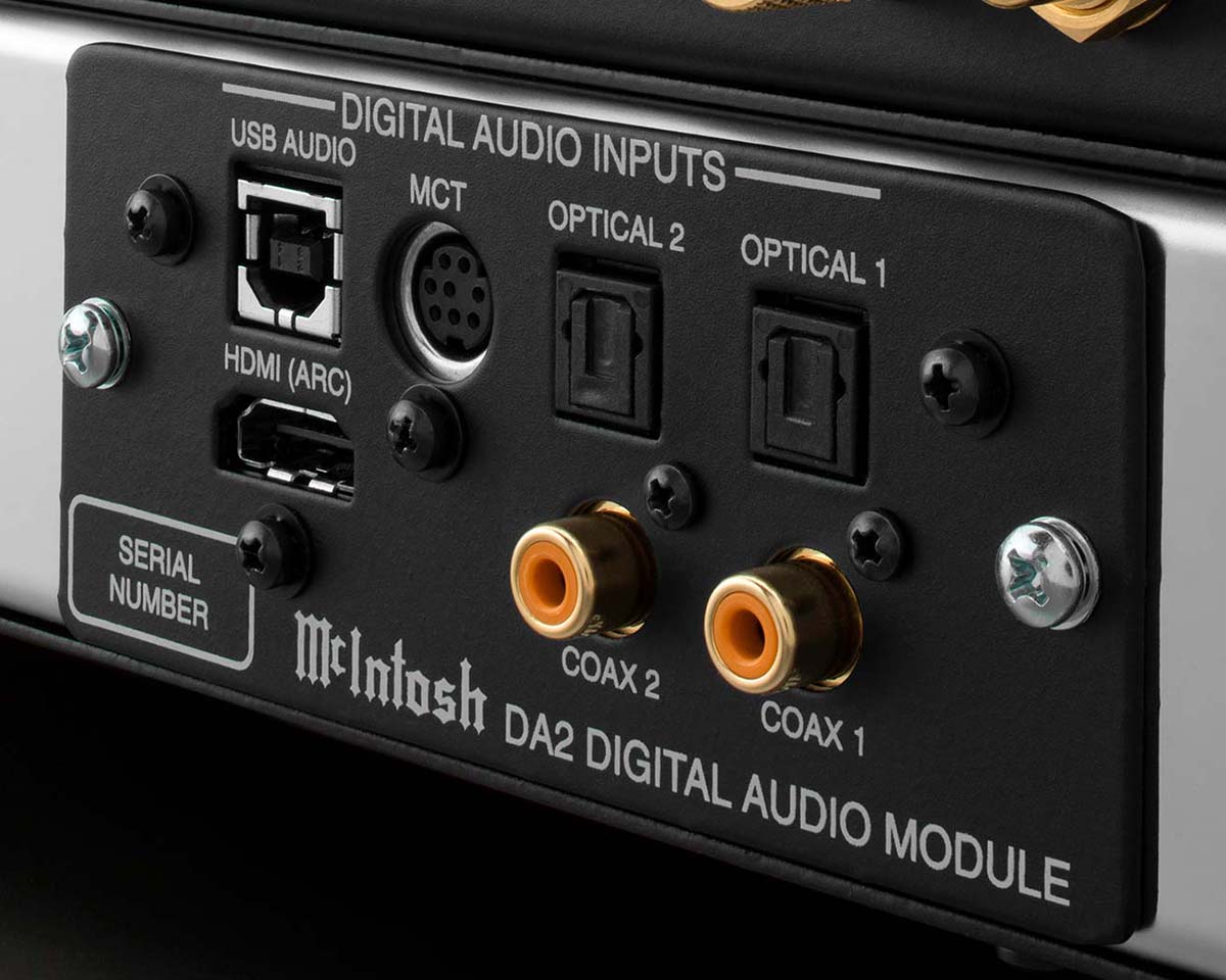 Rear view of a digital audio module showing multiple input ports, including USB, HDMI (ARC), MCT, two optical, and two coaxial inputs. Labels indicate connection types.