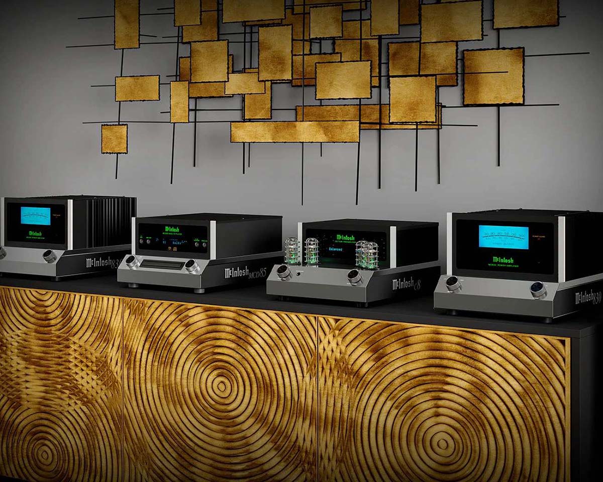 High-end audio equipment with glowing displays on a textured, wood-patterned cabinet. Abstract gold geometric wall art in the background adds elegance.