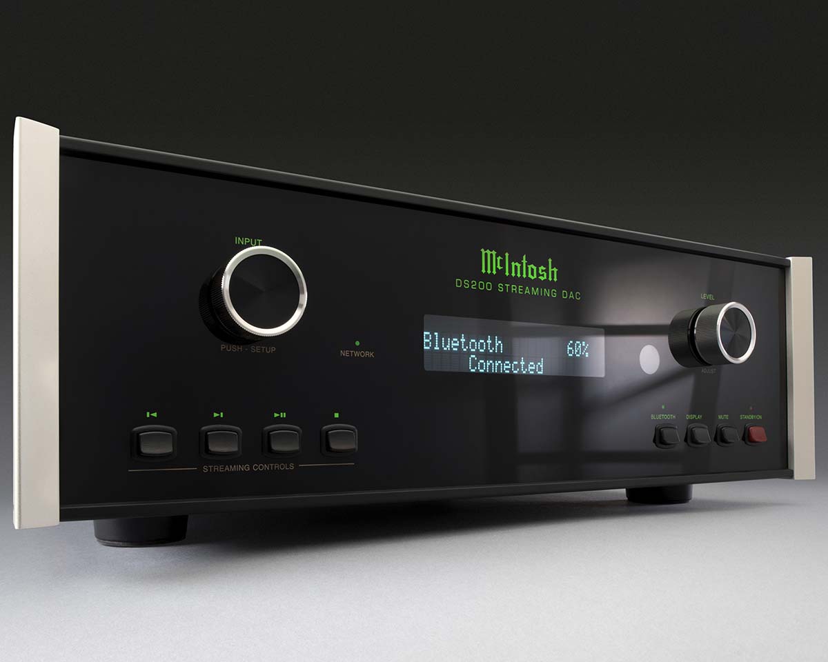 Sleek black audio device with silver knobs and buttons, displaying "Bluetooth Connected 60%" on a digital screen. Modern and high-tech appearance.