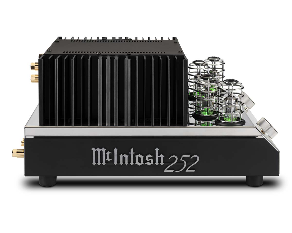 Black and silver McIntosh amplifier 252 with prominent heat sinks and glowing green tubes, conveying a sleek, modern, and high-tech design.