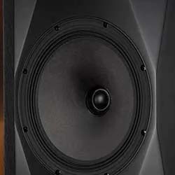 Close-up of a black speaker cone, set in a rectangular frame with angular edges, conveying a sense of power and precision in sound technology.