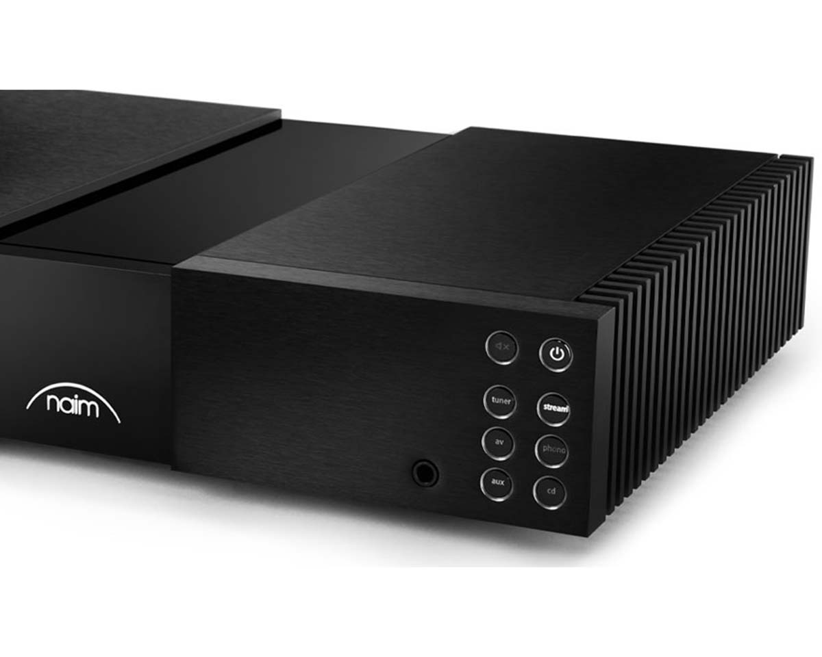 Sleek black audio amplifier with a grille design on the side. Features buttons for power and input options like tuner and CD. Brand logo on the left.