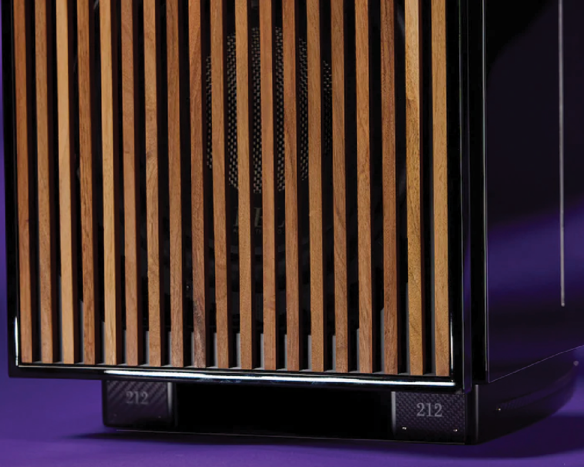 Close-up of a stylish speaker front panel with vertical wooden slats on a dark, glossy surface. The background is a deep purple, conveying a modern, elegant tone.