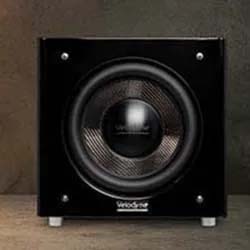 A sleek black subwoofer with a large central speaker cone is set against a minimalist gray background, conveying a modern and powerful audio vibe.