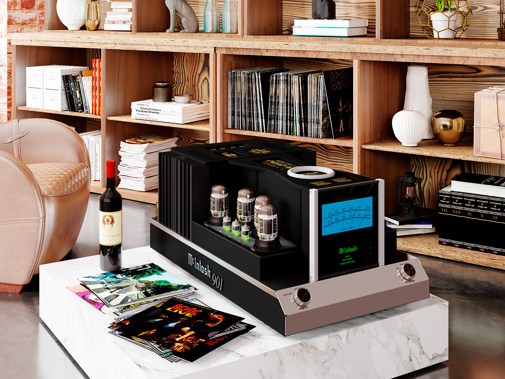 A McIntosh 901 amplifier sits on a marble table in a cozy room with wood shelves filled with books and vinyl records, next to a wine bottle and album covers.