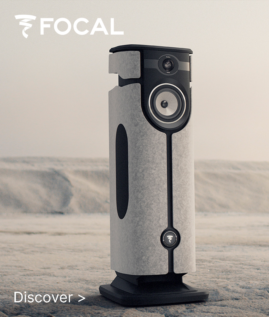 Sleek speaker against a neutral background, featuring a modern design with a white and black finish. Logo “FOCAL” is at the top. Text reads “Discover >”.