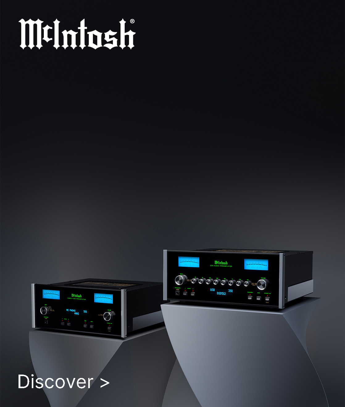 Two sleek McIntosh audio components with illuminated blue meters on elegant pedestals against a dark background. Text reads "Discover >”. Modern and sophisticated vibe.