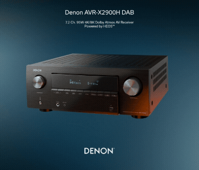 Denon promotional banner for the AVR-X2900H DAB home cinema receiver. The banner features a black 7.2 channel AV receiver angled slightly toward the left against a dark blue gradient backdrop with a subtle mesh pattern texture. The device displays two large silver dials on its front panel, a central digital display screen showing input details, and various small buttons below. Text centered at the top reads "Denon AVR-X2900H DAB" above the description "7.2 Ch. 95W 4K/8K Dolby Atmos AV Receiver Powered by HEOS". The white Denon brand logo is centered at the bottom.