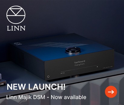 Linn Majik DSM audio system in sleek, modern design set on a dark shelf. Text reads "NEW LAUNCH!" with orange arrow icon, conveying excitement.