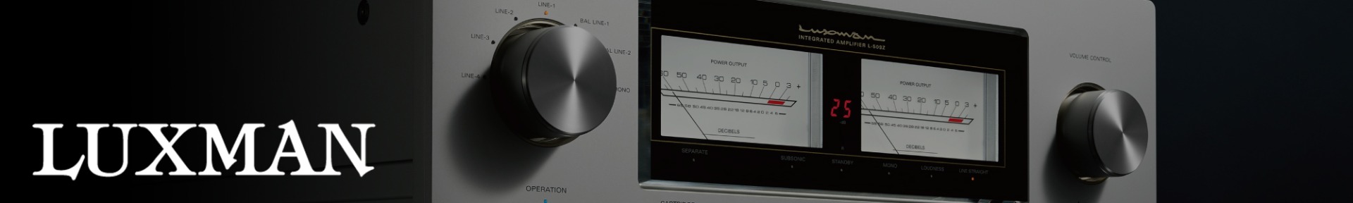 Close-up of a Luxman amplifier with two large dials and illuminated power output meters. The sleek design and dim lighting convey modern sophistication.