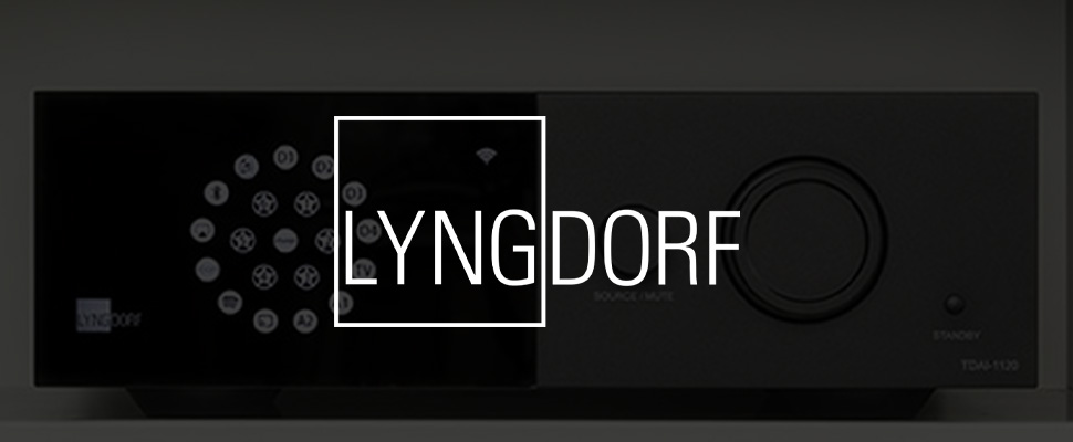 Close-up of a sleek audio device featuring a circular button layout on a black panel. The word "Lyngdorf" appears on the left. Modern and minimalistic design.