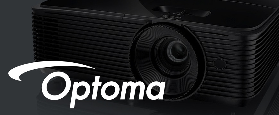 Close-up of a black Optoma projector lens with concentric ridges, conveying a sleek and modern design. The Optoma logo is prominently displayed.