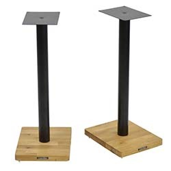 Two speaker stands with square wooden bases and black metal columns, topped with small black metal plates. The design is modern and minimalist.