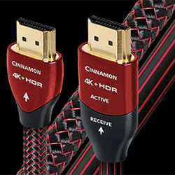 Red and black braided HDMI cable with gold-plated connectors labelled "Cinnamon" and "4K HDR." Text reads "Active" and "Receive."