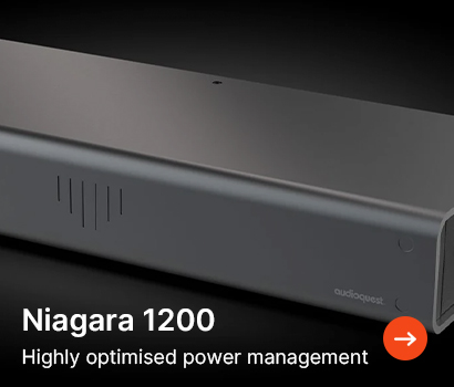 Sleek black AudioQuest Niagara 1200 power management unit on a dark background. 