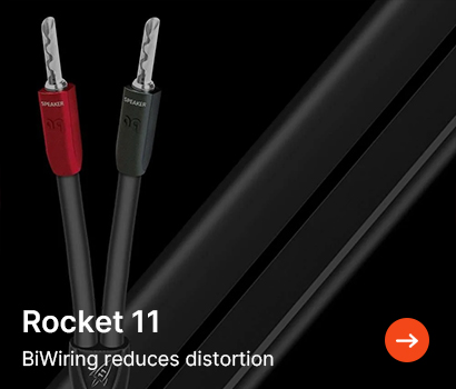 Close-up of two audio cables labelled 'Rocket 11' against a black background. Red and black connectors and text stating, 'BiWiring reduces distortion.'
