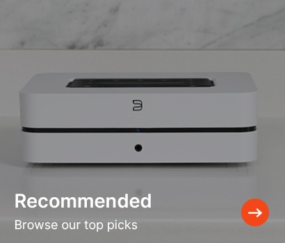 A sleek, rectangular white audio device on a smooth surface, with "Recommended" text and an orange arrow button for browsing top picks. 