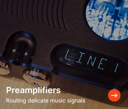 Electronic device display showing "LINE 1" on a dark, textured surface. Text reads "Preamplifiers: Routing delicate music signals." An orange arrow suggests navigation.
