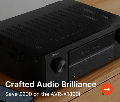 Audio receiver on a wooden surface, displaying brand and model details. Text overlay: "Crafted Audio Brilliance, Save £200 on the AVR-X1800H," with a red arrow.